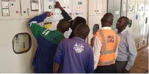 CHINT engineers commissioning an electrical distribution panel on site.