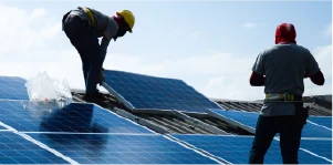 CHINT Uganda solar installation team commissioning a rooftop PV array.